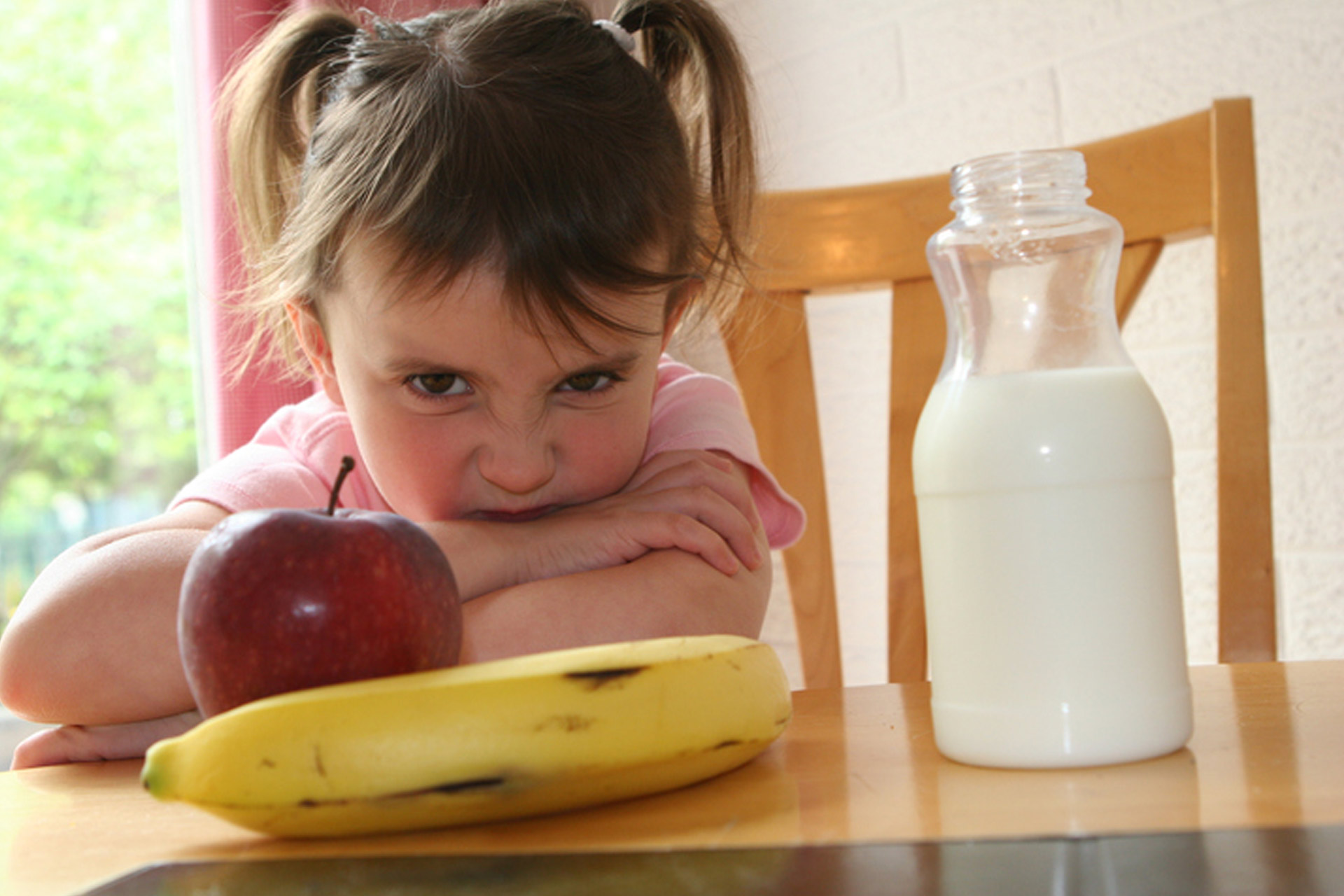 Fussy eater, scowling girl